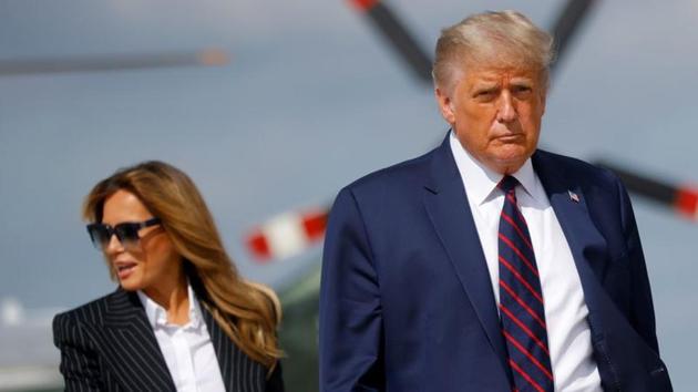 US President Donald Trump and first lady Melania Trump board Air Force One as they depart Washington on campaign travel to participate in the first presidential debate with Democratic presidential nominee Joe Biden in Cleveland, Ohio at Joint Base Andrews, Maryland, US.(REUTERS)