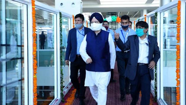 Civil aviation minister Hardeep Singh Puri during the inauguration of the passengers boarding bridges at Chandigarh airport in Mohali on Saturday. (HT photo) Civil aviation minister Hardeep Singh Puri during the inauguration of the passengers boarding bridges at Chandigarh airport in Mohali on Saturday. (HT photo)