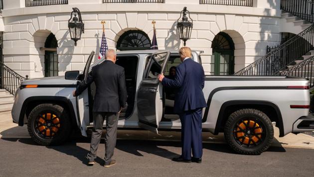 US President Donald Trump and Steve Burns, chief executive officer of Lordstown Motors Corp., survey the new Lordstown Motors Endurance electric pickup truck at the South Lawn of the White House in Washington, DC on September 28. Following this, Trump held a Rose Garden event to announce an administration effort to distribute millions of coronavirus test kits to states. The event was attended by administration officials including Vice President Mike Pence, members of Congress and state officials. (Ken Cedeno / Sipa / Bloomberg)