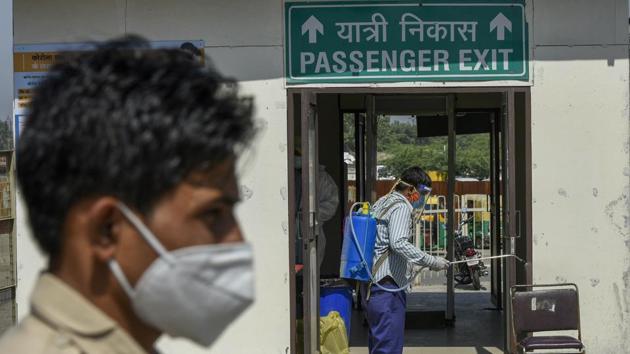 A sanitisation worker disinfects a chair used for collecting samples from people for Covid-19 tests at Sarai Kale Khan ISBT in New Delhi on October 2. Since the first week of September, daily deaths in India have outstripped every country in the world. On average, 1,065 people have died every day over the past week in the country, against 755 average daily deaths in the US and 713 in Brazil in the same period, HT reported. (Biplov Bhuyan / HT Photo)