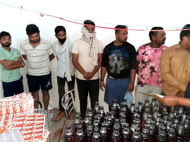 Bottles of fake liquor seized at a factory in Panchkula district.(HT Photo)