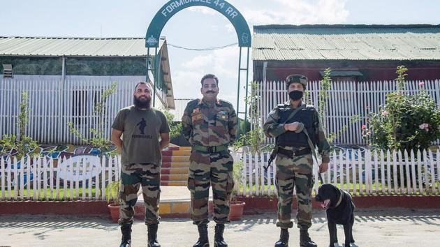 The image shows two-year-old Rosh, a labrador, with Col A K Singh and his team after a day's hardwork in terrain of J&K. (PTI) The image shows two-year-old Rosh, a labrador, with Col A K Singh and his team after a day's hardwork in terrain of J&K. (PTI)