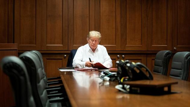 US President Donald Trump works in a conference room while receiving treatment after testing positive for the coronavirus disease (Covid-19) at Walter Reed National Military Medical Center in Bethesda, Maryland, US.(via REUTERS)