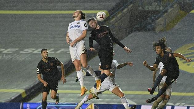 Leeds United's Luke Ayling, 2nd left, jumps for the ball during the English Premier League soccer match between Leeds United and Manchester City.(AP)