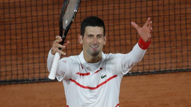 Serbia's Novak Djokovic celebrate winning his third round match of the French Open tennis tournament against Colombia's Daniel Elahi Galan in three sets 6-0, 6-3, 6-3, at the Roland Garros stadium in Paris, France.(AP)