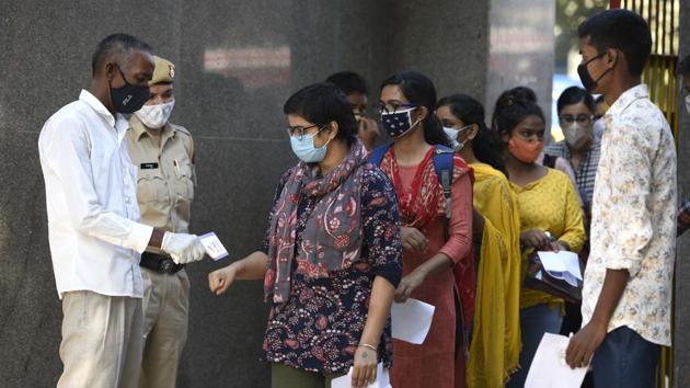 Candidates are thermal scanned before entering the exam centre to appear for Union Public Service Commission (UPSC) Prelims. Examination, which is among the largest recruitment exams held in the country, in Gurugram on October 04. (Parveen Kumar / HT Photo)