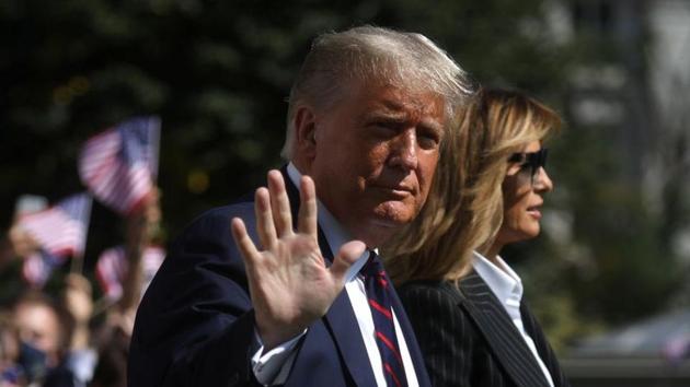 US President Donald Trump waves to reporters as he departs with first lady Melania Trump for campaign travel to participate in his first presidential debate with Democratic presidential nominee Joe Biden in Cleveland, Ohio on September 29.(Reuters file)