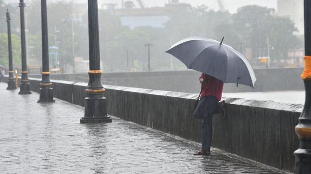 File photo: People deal with rain at Gateway of India at Colaba in Mumbai. (Satish Bate/HT PHOTO) File photo: People deal with rain at Gateway of India at Colaba in Mumbai. (Satish Bate/HT PHOTO)