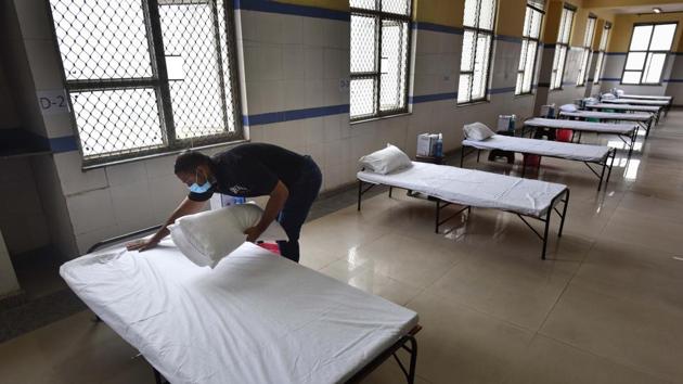 A worker makes a bed at a newly built Covid-19 isolation ward in Balak Ram Hospital, Timarpur, New Delhi. (Sanchit Khanna/HT photo) A worker makes a bed at a newly built Covid-19 isolation ward in Balak Ram Hospital, Timarpur, New Delhi. (Sanchit Khanna/HT photo)