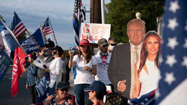 Photos: Covid-19 positive Trump criticised for greeting supporters ...