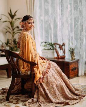 Niti wore a bigger golden-beige dupatta with her pastel pink lehenga, matching her jewellery with the colour of her lehenga. (Instagram)
