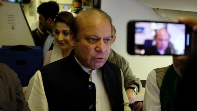 Ousted Pakistani Prime Minister Nawaz Sharif gestures as he boards a Lahore-bound flight due for departure, at Abu Dhabi International Airport, UAE July 13, 2018.(Reuters file)