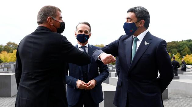 Israeli Foreign Minister Gabi Ashkenazi (L) greets UAE Foreign Minister Sheikh Abdullah bin Zayed al-Nahyan as German Foreign Minister Heiko Maas looks on during a visit of the Holocaust memorial prior to their historic meeting in Berlin.(AFP)