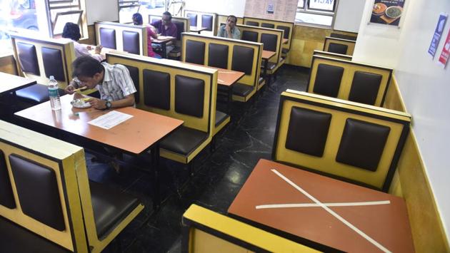 Social distancing measures seen in place as customers dine at Liberty Hotel in Mumbai on October 5. Nearly 1.20 lakh hotels of the total 4 lakh hotels and restaurants in Maharashtra resumed business with fifty percent capacity on October 5, after the state issued Covid- 19 related guidelines for hotels and restaurants to reopen on October 3. (Anshuman Poyrekar / HT Photo)