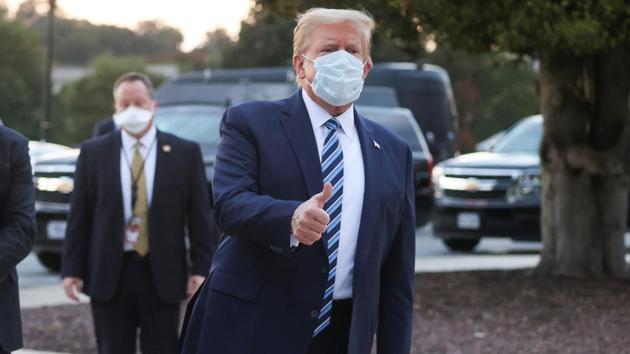 US President Donald Trump gives a thumbs up as he departs Walter Reed National Military Medical Center after a fourth day of treatment for the coronavirus disease (Covid-19).(Reuters Photo)