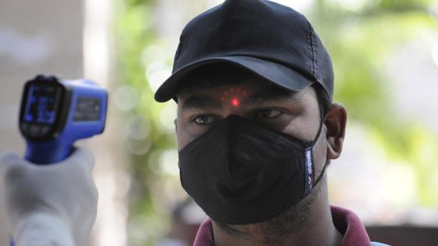 A visitor undergoes thermal screening at Sector 30 District Hospital, in Noida on Monday. (Sunil Ghosh /HT Photo) A visitor undergoes thermal screening at Sector 30 District Hospital, in Noida on Monday. (Sunil Ghosh /HT Photo)