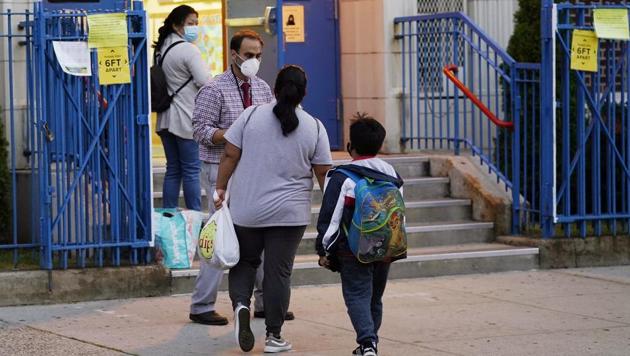 Scene outside a school in the Brooklyn borough of New York. New York governor Andrew Cuomo ordered schools in certain areas of Brooklyn and Queens to close due to flare-ups of the coronavirus in those areas. (AP Photo/Kathy Willens) Scene outside a school in the Brooklyn borough of New York. New York governor Andrew Cuomo ordered schools in certain areas of Brooklyn and Queens to close due to flare-ups of the coronavirus in those areas. (AP Photo/Kathy Willens)