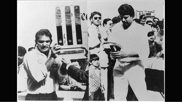 Indian captain Mohammad Azharuddin (L) holds the winners’ trophy and the highest wicket taker in the world then; Kapil Dev (R) seen with a special trophy after defeating Sri Lanka in the third test match in Ahmedabad, Gujarat on February 12, 1994. (PTI)