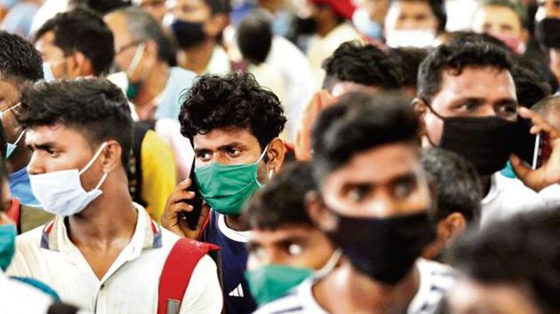 Back from their hometowns, migrants wait to be tested for the Covid-19 at a camp on the outskirts of Mumbai. (Reuters file photo) Back from their hometowns, migrants wait to be tested for the Covid-19 at a camp on the outskirts of Mumbai. (Reuters file photo)