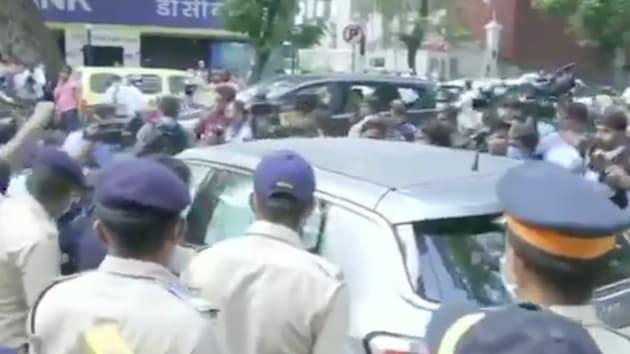 Rhea Chakraborty’s car surrounded by media and the police.(ANI) Rhea Chakraborty’s car surrounded by media and the police.(ANI)