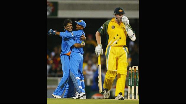 Indian cricketers Irfan Pathan and Rahul Dravid celebrate the final wicket of Brad Williams during the VB Series one-day international match against Australia at the Gabba in Brisbane, Australia on January 18, 2004. Not so long ago, Sinha’s favourite cricketer Rahul Dravid had contacted him on Twitter via his manager to procure an old innings he had played against the West Indies in 2006. (Hamish Blair / Getty Images)