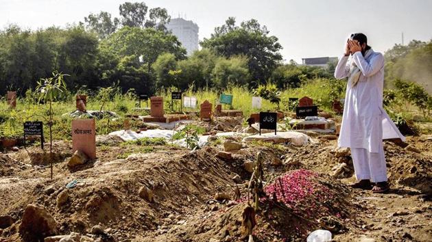 A man prays next to the grave of a relative at the Delhi Gate graveyard. (Reuters photo) A man prays next to the grave of a relative at the Delhi Gate graveyard. (Reuters photo)
