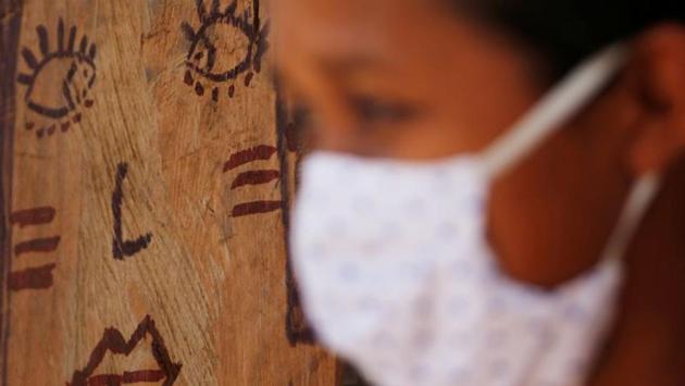 A Guajajara woman at a community school during check-ups in Morro Branco on October 4. There have been 447 deaths from COVID-19 so far among Brazil’s 800,000 indigenous people, according to SESAI, which only provides health care to those living on reservations. Another 388 have died off reservation in urban areas, according to the main indigenous umbrella organization APIB. (Adriano Machado / REUTERS)