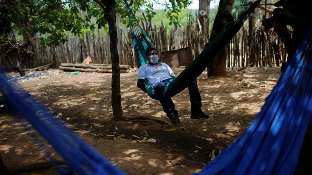 Jose Aldrinho Guajajara from the Guajajara ethnic group cured of the coronavirus looks on, in Bacurizinho on October 5. Indigenous and human rights groups such as the Indigenous Missionary Council (Cimi) and Human Rights Watch have criticized the government for reducing the SESAI’s scope and ignoring the plight of indigenous people in the face of the pandemic. (Adriano Machado / REUTERS)