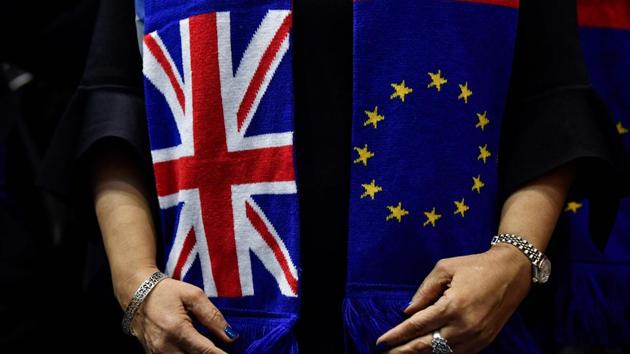 A British member of the European Parliament from the Group of the Progressive Alliance of Socialists and Democrats pose for a picture wearing scarves depicting the European Union and the Union Jack flags. (AFP file) A British member of the European Parliament from the Group of the Progressive Alliance of Socialists and Democrats pose for a picture wearing scarves depicting the European Union and the Union Jack flags. (AFP file)