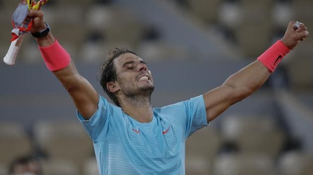 Rafael Nadal celebrates winning his quarterfinal match of the French Open tennis tournament against Italy's Jannik Sinner in three sets, 7-6 (7-4), 6-4, 6-1, at the Roland Garros stadium in Paris.(AP)