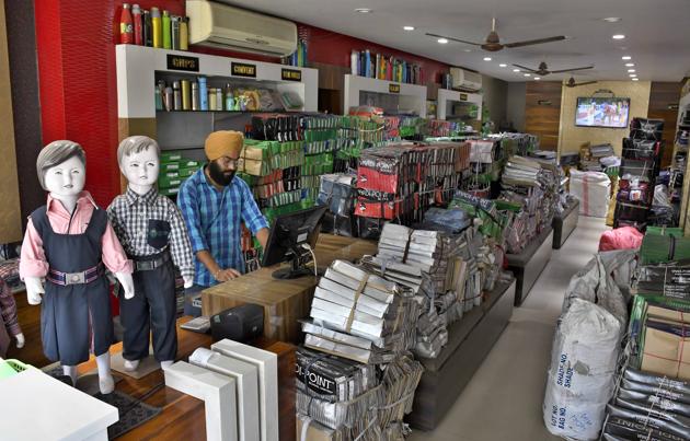 Unprecedented disruption in demand due to closure of schools has left uniform shops, such as this one in Model Town, with large stocks of summer collection.(Harsimar Pal Singh/HT)