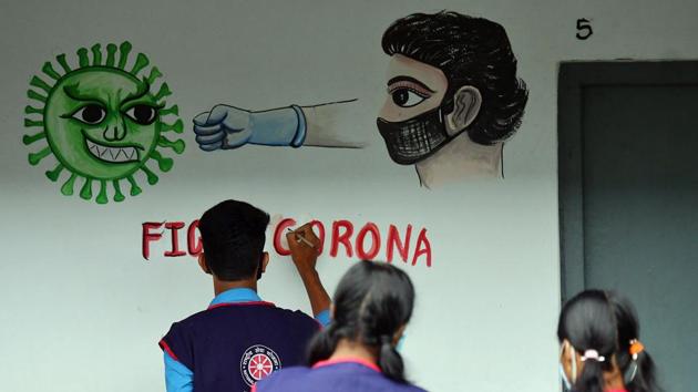 Tripura, NSS ( National Service Scheme) volunteers and students paint on a wall to spread awareness about Covid-19 in Agartala (ANI) Tripura, NSS ( National Service Scheme) volunteers and students paint on a wall to spread awareness about Covid-19 in Agartala (ANI)
