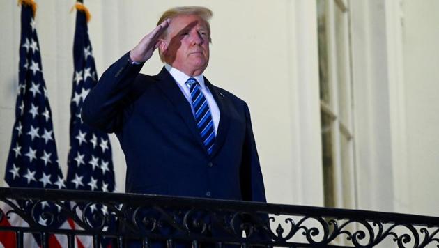 US President Donald Trump salutes as he poses without a face mask on the Truman Balcony of the White House after returning from being hospitalized at Walter Reed Medical Center for coronavirus disease (Covid-19) treatment, in Washington (REUTERS/Erin Scott/File Photo) US President Donald Trump salutes as he poses without a face mask on the Truman Balcony of the White House after returning from being hospitalized at Walter Reed Medical Center for coronavirus disease (Covid-19) treatment, in Washington (REUTERS/Erin Scott/File Photo)