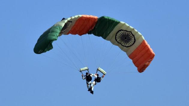 Indian Air Force (IAF) paratroopers perform during the 88th Indian Air Force Day celebrations at Hindon Airbase in Ghaziabad on October 8. The IAF was established on October 8, 1932, in undivided India under colonial rule. It was given the prefix “Royal” by King George VI for its contribution during the Second World War. The prefix was later dropped in 1950 when India became a republic. (Sanjeev Verma / HT Photo)