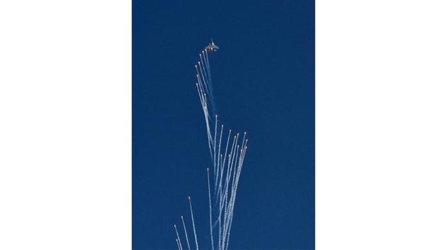 A Su-30 fighter aircraft fires flares during the 88th Indian Air Force Day celebrations at Hindon Airbase in Ghaziabad on October 8. (Sanjeev Verma / HT Photo)
