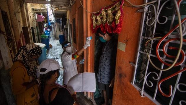 Health workers conduct door to door screening of residents in Mumbai on October 7. The reversal in trajectory has been led by the some of the states that have so far caused the national spike in cases — Maharashtra, Tamil Nadu, Andhra Pradesh and Delhi. Together, these four states have been responsible for 46% of all infections in the country. (Pratik Chorge / HT Photo)