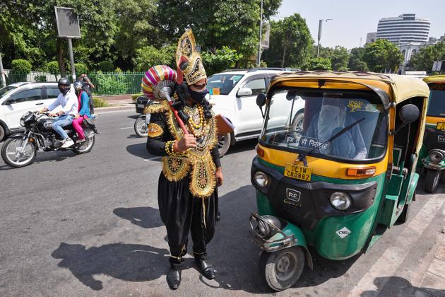 A man dressed as 'Yamraj' (R) during a campaign organised by the Delhi Police to raise awareness on the importance of wearing face-masks and maintaining social distancing in public due to coronavirus outbreak, Connaught place, New Delhi, September 28, 2020 (Biplov Bhuyan/HT PHOTO) A man dressed as 'Yamraj' (R) during a campaign organised by the Delhi Police to raise awareness on the importance of wearing face-masks and maintaining social distancing in public due to coronavirus outbreak, Connaught place, New Delhi, September 28, 2020 (Biplov Bhuyan/HT PHOTO)