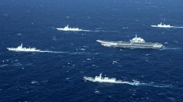 This aerial file photo taken on January 2, 2017 shows a Chinese Navy formation, including the aircraft carrier Liaoning (C), during military drills in the South China Sea.(AFP/ File)