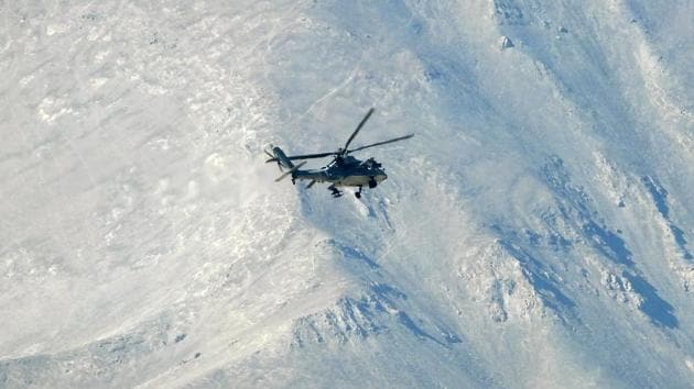 Indian Air Force Apache helicopter seen flying around the mountains in Leh.(ANI) Indian Air Force Apache helicopter seen flying around the mountains in Leh.(ANI)