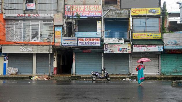 A woman walks along a deserted street after a new lockdown was imposed as a preventive measure against the spread of the coronavirus, in Siliguri on July 20. (AFP) A woman walks along a deserted street after a new lockdown was imposed as a preventive measure against the spread of the coronavirus, in Siliguri on July 20. (AFP)