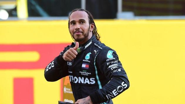 Mercedes' Lewis Hamilton celebrates after winning the race.(Pool via REUTERS)