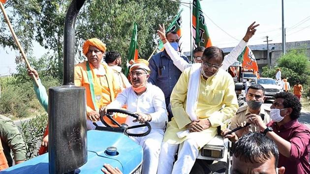 BJP state president OP Prakash Dhankar during the tractor rally in Sonepat district on Friday.(Manoj Dhaka/HT) BJP state president OP Prakash Dhankar during the tractor rally in Sonepat district on Friday.(Manoj Dhaka/HT)