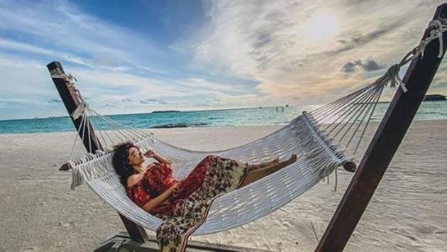 It’s hammock time for Taapsee on white sand beach. 