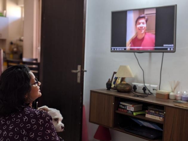 Shipra Dubey, 30, a resident of Delhi, watches a birthday video greeting from singer Shaan, gifted to her by her husband in September.(Abhinay Dubey)