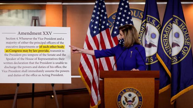 US House Speaker Nancy Pelosi on Friday refers to a 25th Amendment display as she announces plans for Congress to create a "Commission on Presidential Capacity to Discharge the Powers and Duties of Office Act," after US President Donald Trump came down with coronavirus disease. (REUTERS) US House Speaker Nancy Pelosi on Friday refers to a 25th Amendment display as she announces plans for Congress to create a "Commission on Presidential Capacity to Discharge the Powers and Duties of Office Act," after US President Donald Trump came down with coronavirus disease. (REUTERS)