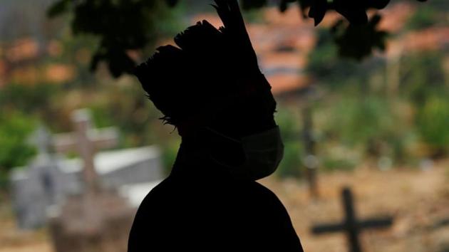 A man from the Guajajara indigenous ethnic group stands at a community school in the indigenous village of Morro Branco in Maranhao on October 4. “I wouldn’t recommend governments to relax further; there’s still room for big spikes based on people moving around and not wearing masks,” Michael Touchton, a political science professor at the University of Miami told AP. (Adriano Machado / Reuters)