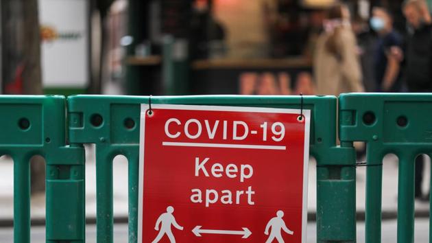 A sign reading "Covid-19 Keep Apart", sits on a temporary protective pedestrian barrier on Oxford Street in central London, U.K., on Thursday, Oct. 1, 2020. The City of London's traffic-lite streets look set to outlast the pandemic. (Bloomberg) A sign reading "Covid-19 Keep Apart", sits on a temporary protective pedestrian barrier on Oxford Street in central London, U.K., on Thursday, Oct. 1, 2020. The City of London's traffic-lite streets look set to outlast the pandemic. (Bloomberg)