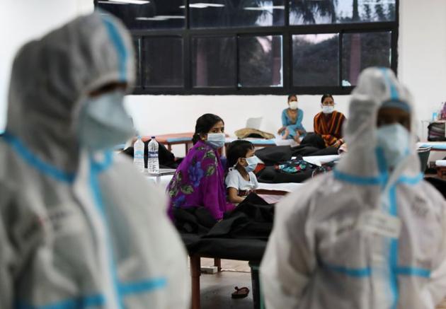FILE PHOTO: A woman sits with her child inside a quarantine centre for the coronavirus disease (COVID-19) patients amidst the spread of the disease at an indoor sports complex in New Delhi, India, September 22, 2020. (Representational image) (REUTERS) FILE PHOTO: A woman sits with her child inside a quarantine centre for the coronavirus disease (COVID-19) patients amidst the spread of the disease at an indoor sports complex in New Delhi, India, September 22, 2020. (Representational image) (REUTERS)