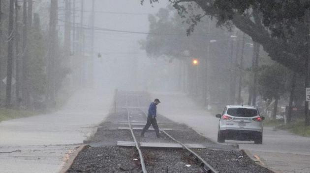 A man returns to his vehicle after checking road conditions during heavy rainfall ahead of the arrival of Hurricane Delta in Lake Charles, Louisiana, US. (Reuters) A man returns to his vehicle after checking road conditions during heavy rainfall ahead of the arrival of Hurricane Delta in Lake Charles, Louisiana, US. (Reuters)