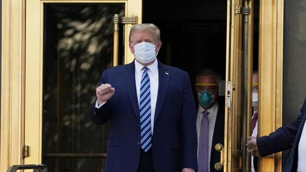 President Donald Trump walks out of Walter Reed National Military Medical Center to return to the White House after receiving treatments for Covid-19, Monday, October 5, 2020, in Bethesda. (AP) President Donald Trump walks out of Walter Reed National Military Medical Center to return to the White House after receiving treatments for Covid-19, Monday, October 5, 2020, in Bethesda. (AP)